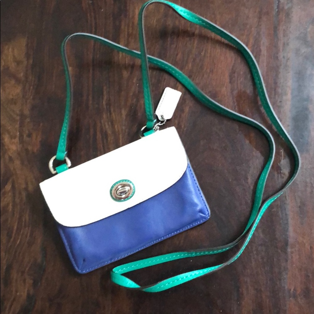 Coach clutch with shoulder straps.
